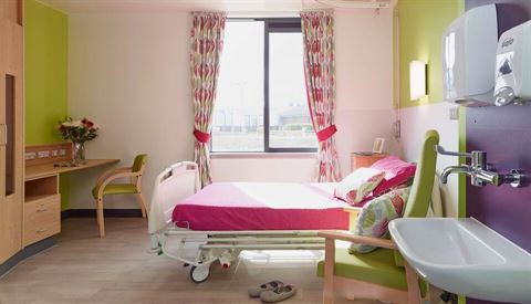 care home room with nursing bed